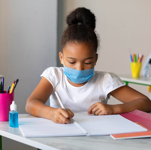 girl-writing-class-while-wearing-medical-mask-2